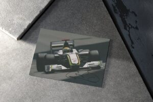 Photo. "2009 Formula 1 World Champion" - signed by driver Jenson Button