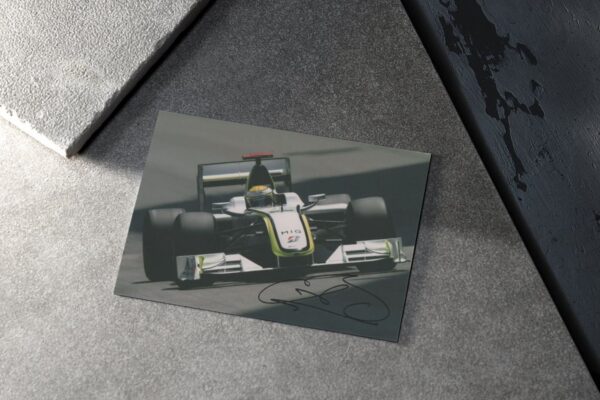 Photo. "2009 Formula 1 World Champion" - signed by driver Jenson Button
