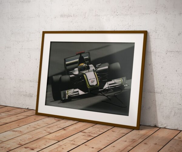 Photo. "2009 Formula 1 World Champion" - signed by driver Jenson Button