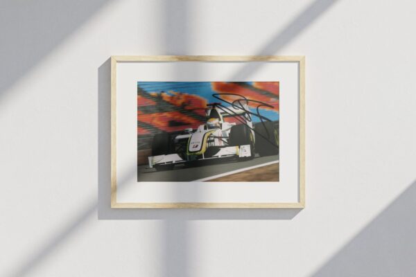 Photo. "2009 Formula 1 World Champion" - signed by driver Jenson Button